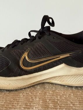 Nike Women’s Black and Gold Training Sneakers